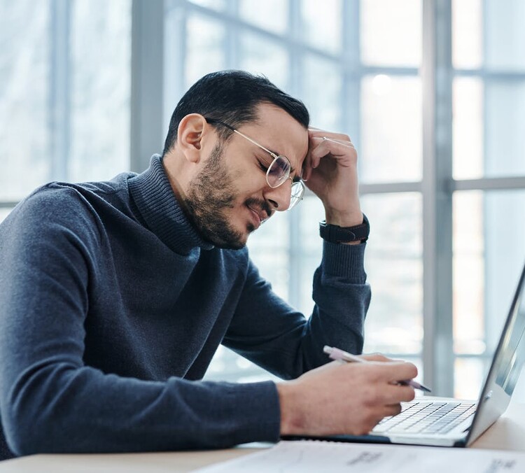 man-struggling-with-legacy-system